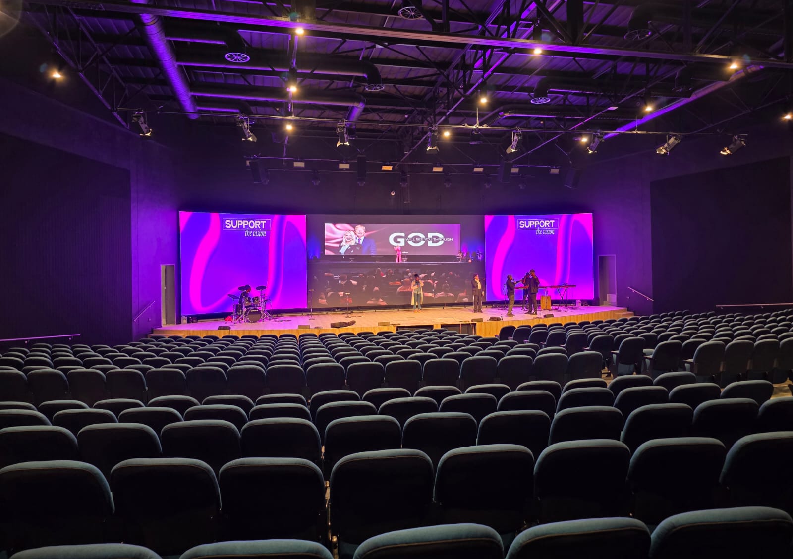 Church seating in a South African sanctuary with LED worship screens