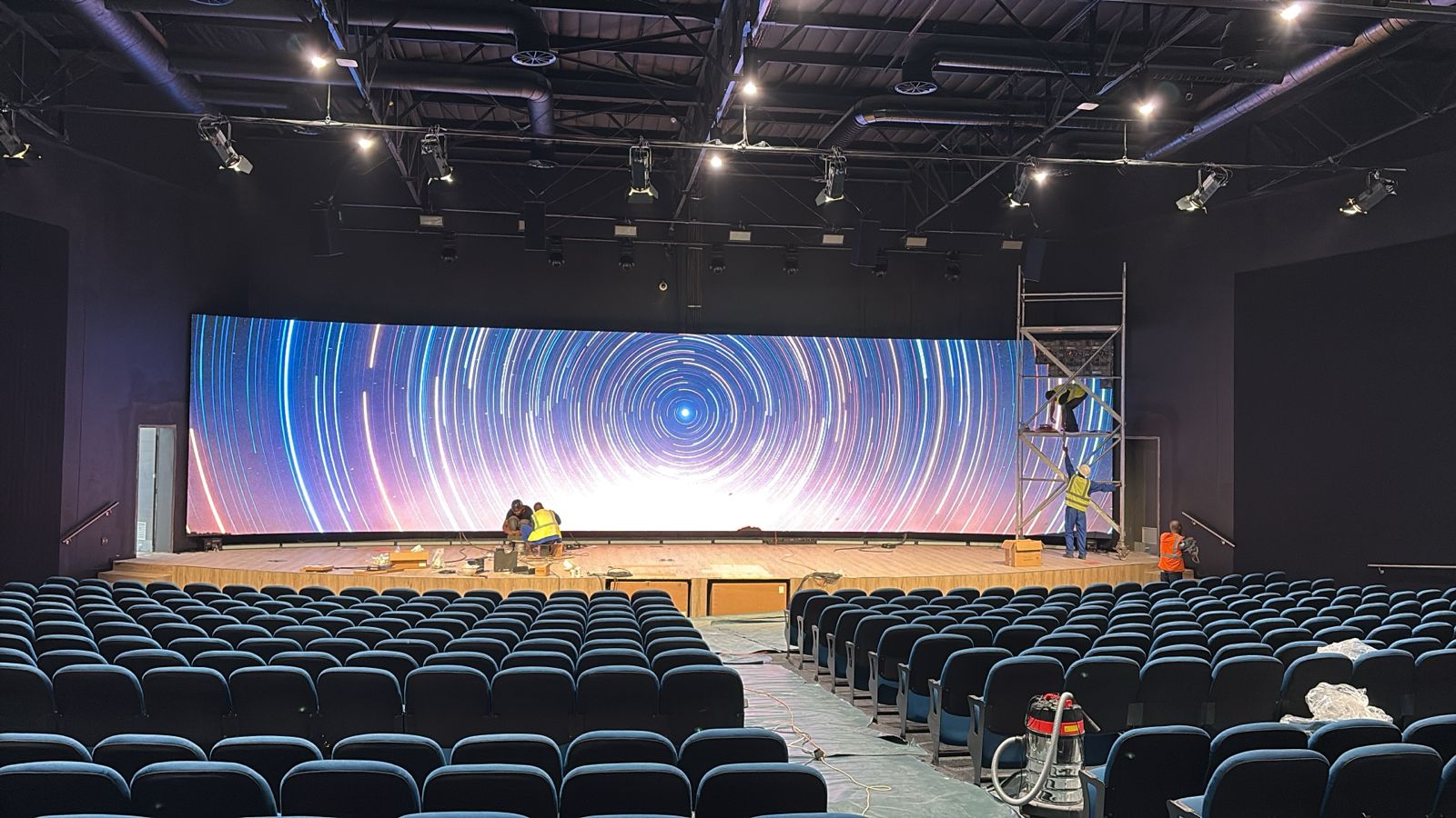 Cinema seating facing a curved LED theatre video wall