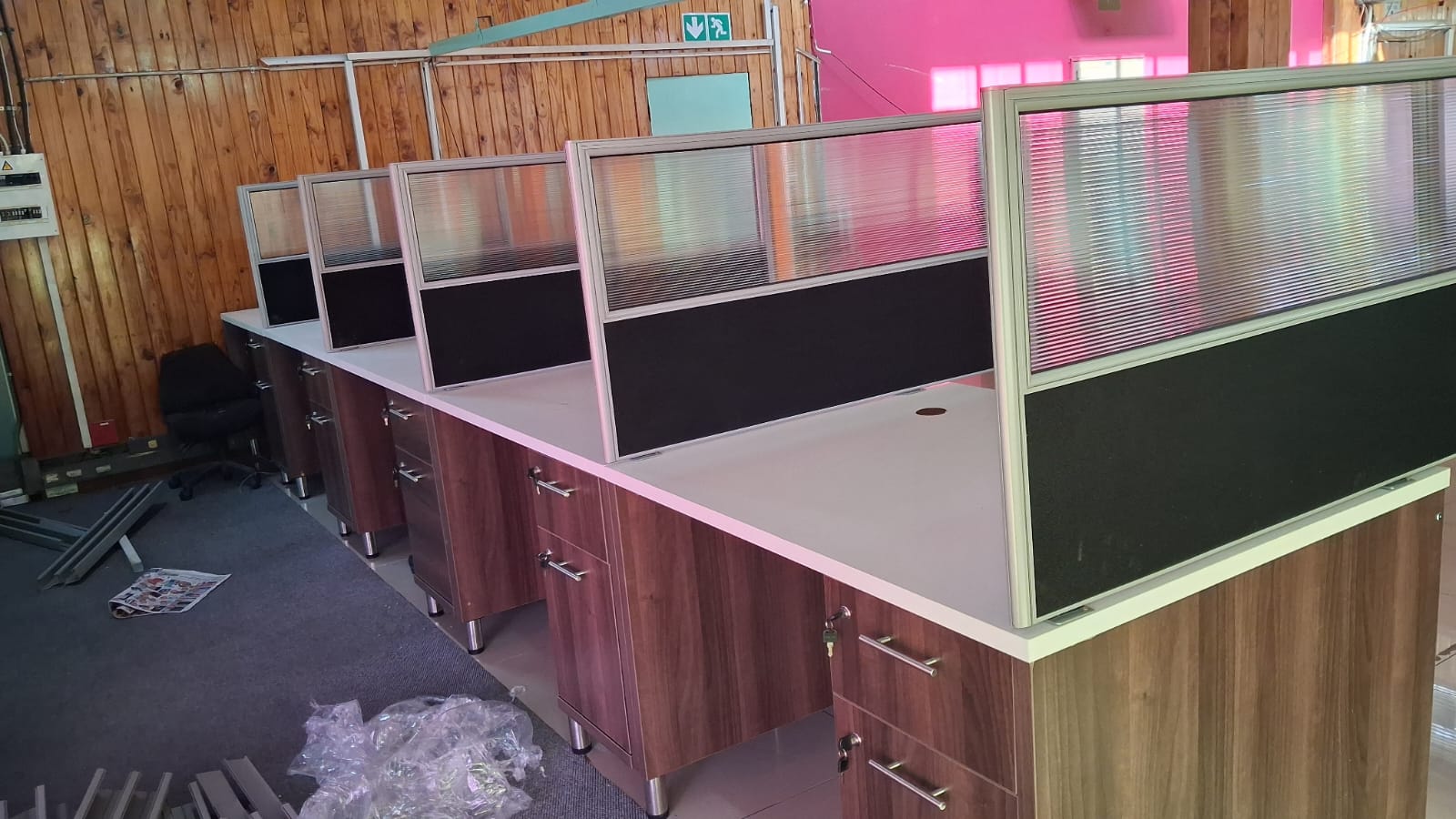 Open-plan cubicle desking with white tops